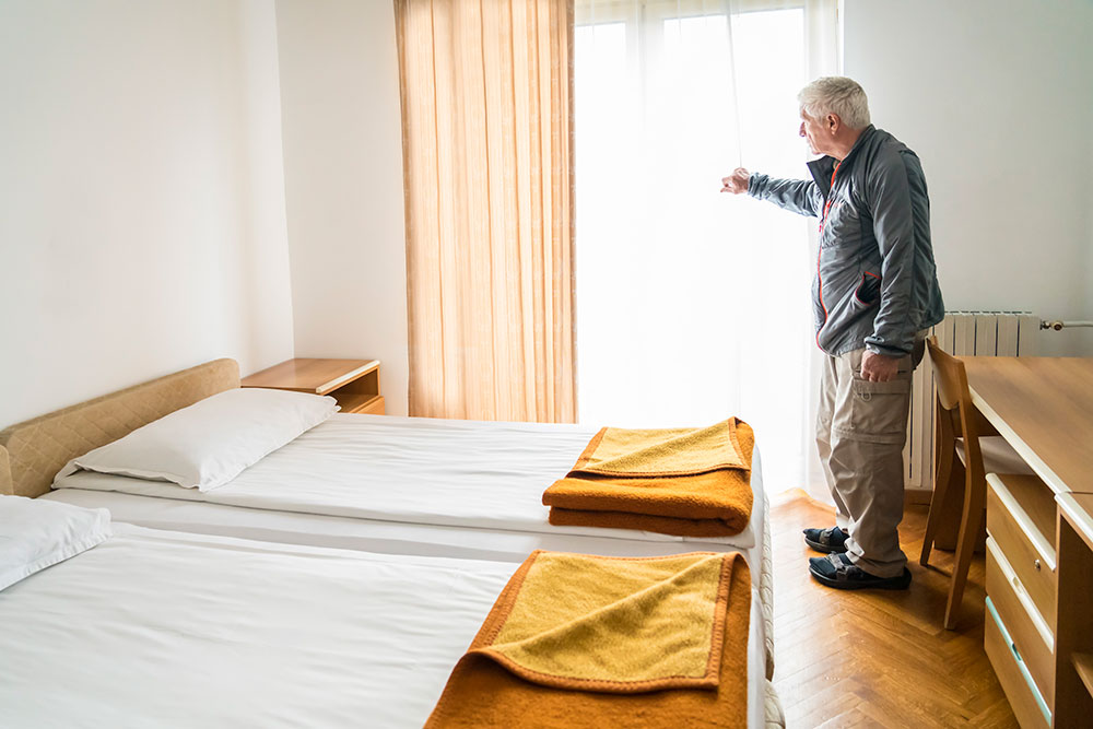 elderly gentleman in a group housing room