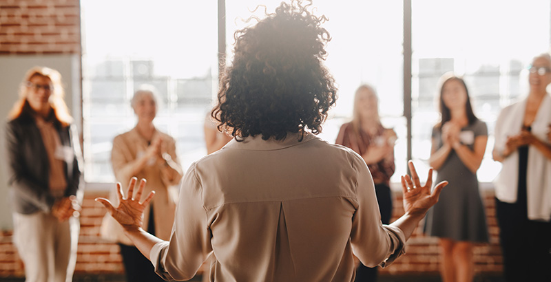 woman speaking to a group