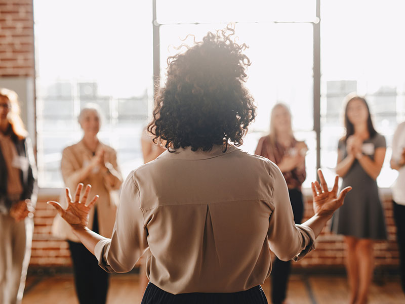 woman speaking to a group