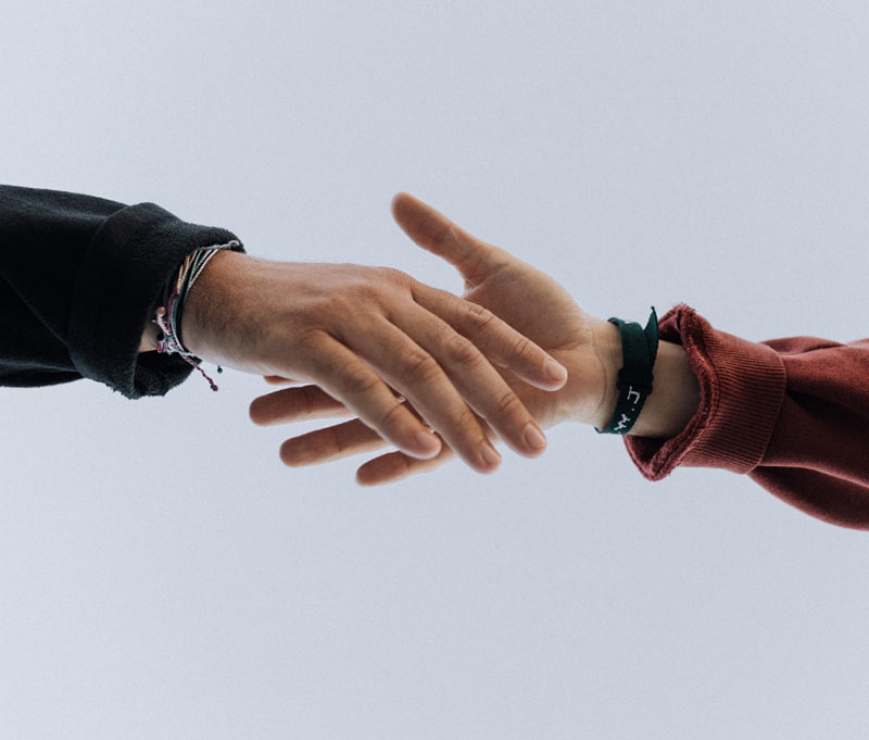 two people about to shake hands