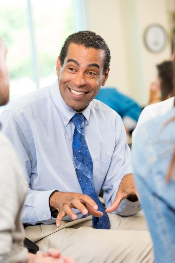 business man talking excitedly to others